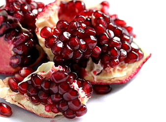 Fresh Pomegranate Seeds Close Up On White Background