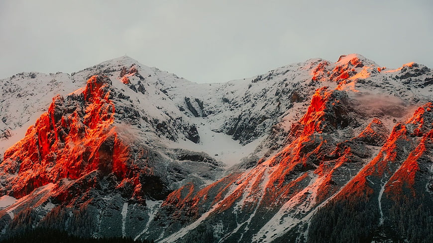Snowy Mountain Peaks Bathed in Golden Hour Alpenglow