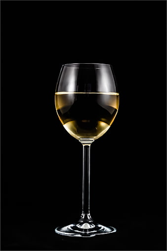 Elegant Glass of White Wine on Black Background