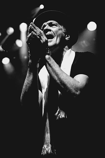 Passionate Male Singer Performing on Stage in Black and White