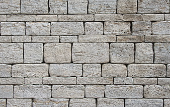 Textured Gray Stone Brick Wall Facade Background