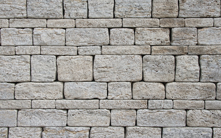 Textured Gray Stone Brick Wall Facade Background