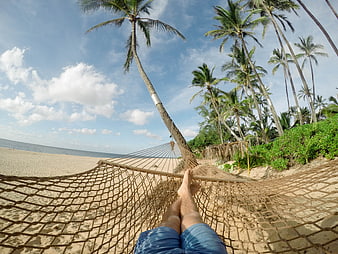 First Person View Relaxing in Hammock on Tropical Beach