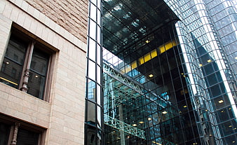Modern Glass Skyscraper and Traditional Stone Building Architecture