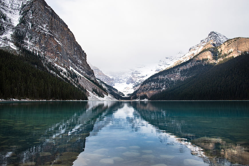 Serene Alpine Lake with Snow-Capped Mountain Reflections