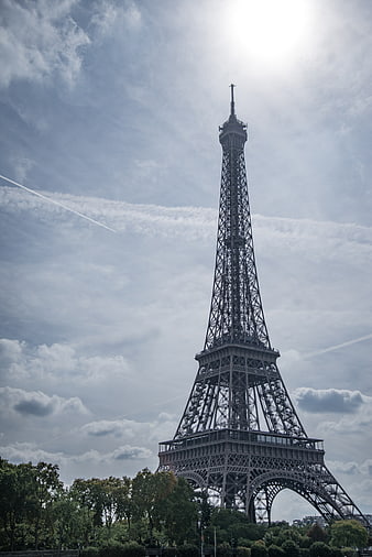 Eiffel Tower Against Cloudy Sky in Paris