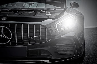Close-up of Black Mercedes-AMG Front Grille and Headlight