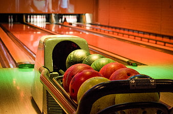 Colorful Bowling Balls in Return Machine at Alley