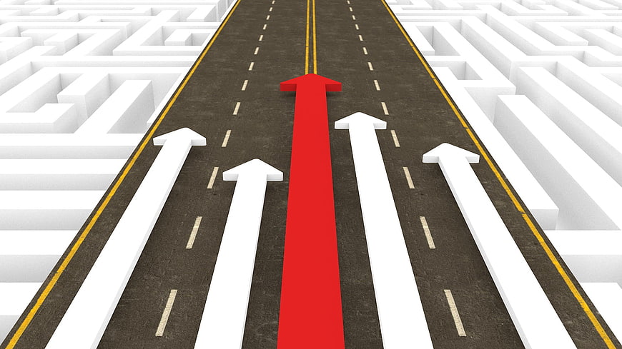 Red arrow leading on road through white maze concept