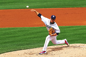 Baseball Pitcher Throwing Ball on Field