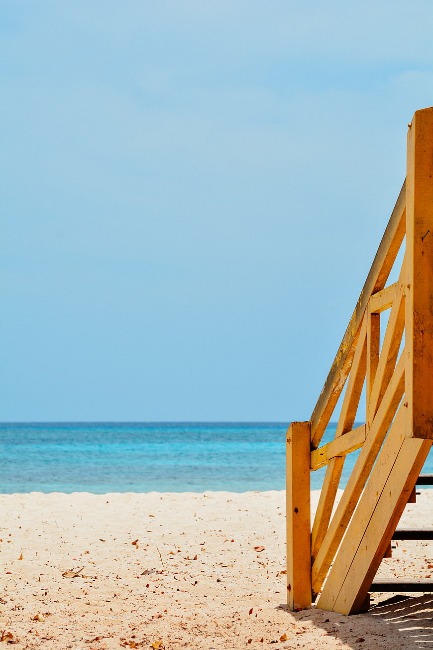 Wooden Staircase on Tropical Beach with Blue Sky