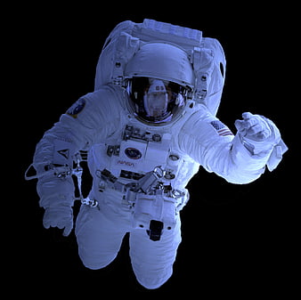 Astronaut in NASA spacesuit floating in space