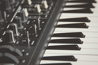 Close-up of electronic keyboard keys and control knobs