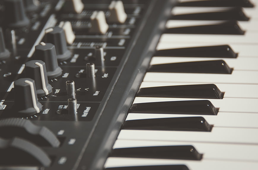 Close-up of electronic keyboard keys and control knobs