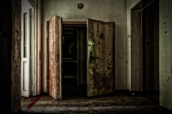 Abandoned Dilapidated Building Interior with Rusty Double Doors