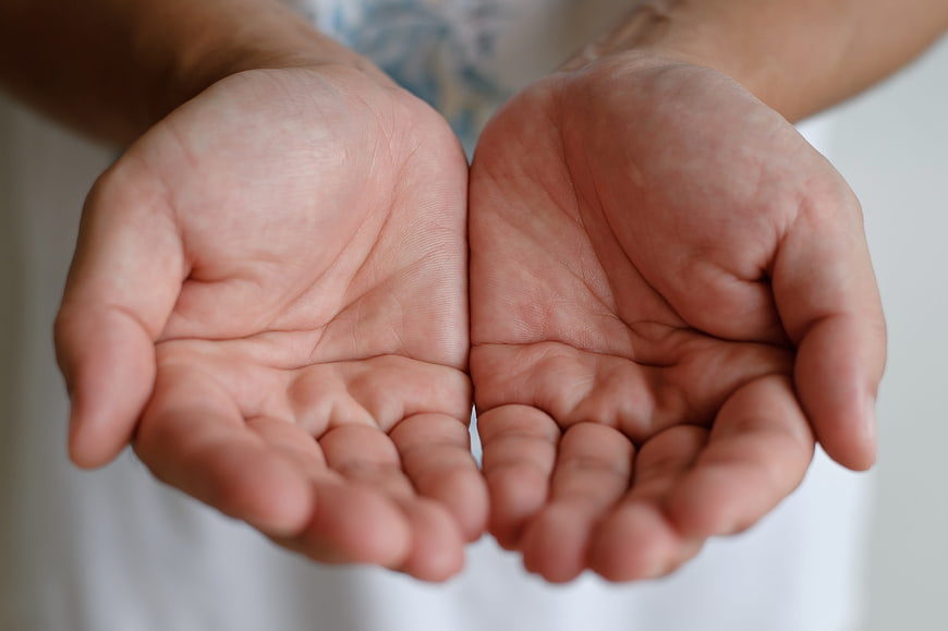 Close-up of open human palms facing forward