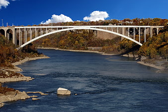 White Arch Bridge Over River in Autumn Landscape