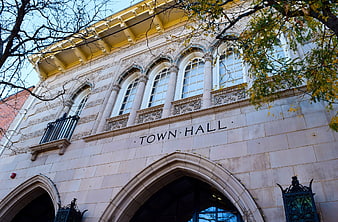 Historic Town Hall Building with Gothic Arched Windows