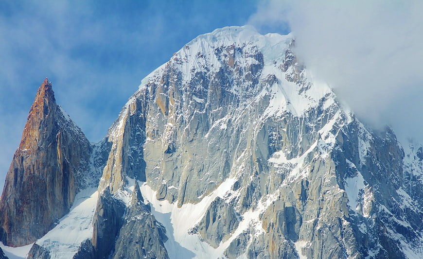 Majestic Snow-Capped Mountain Peak with Clouds