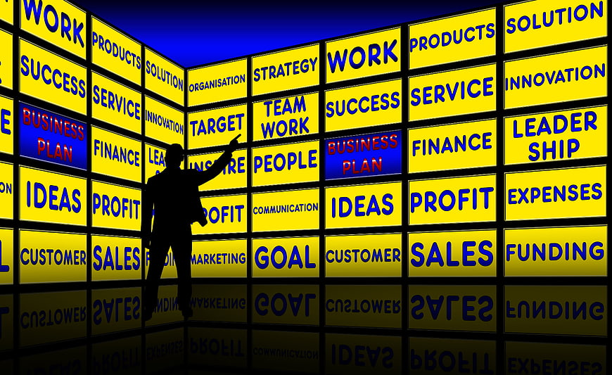 Business Strategy Wall With Silhouette Pointing At Goals