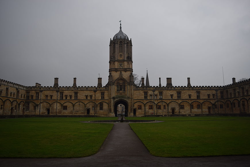 Symmetrical historic university courtyard with central clock tower