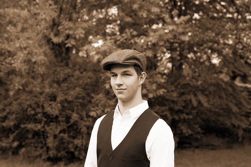 Vintage Portrait of Young Man in Flat Cap and Vest