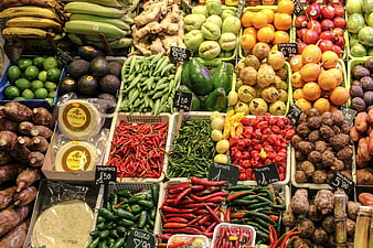 Colorful variety of fresh fruits and vegetables at a market stall