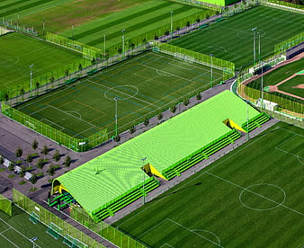 Aerial View of Modern Sports Complex with Green Stadium