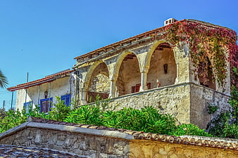 Traditional stone house with arched balcony in Cyprus