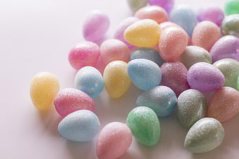 Pastel Easter Eggs with Sugar Glitter on White Background