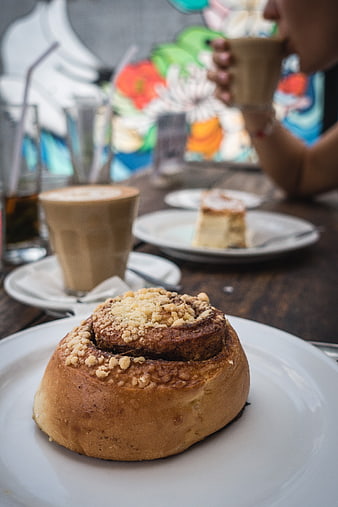 Cinnamon Roll with Coffee in a Cozy Cafe