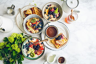 Overhead Healthy Breakfast Spread With Waffles, Oatmeal, Berries, And Honey