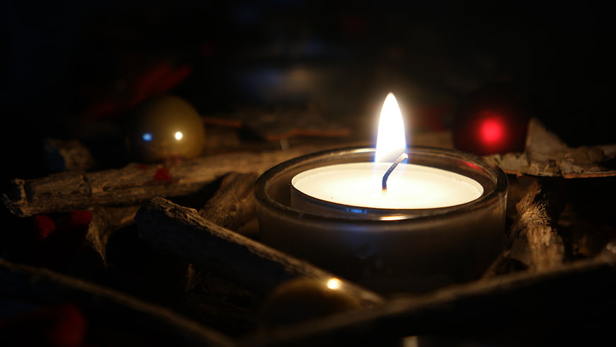 Lit Tea Light Candle in Advent Wreath with Twigs and Ornaments