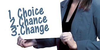 Businesswoman holding sign with choice, chance, change text