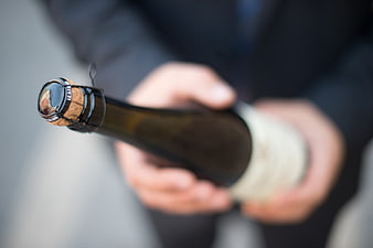 Close-up of Champagne Bottle Cork in Hands