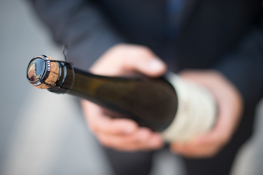 Close-up of Champagne Bottle Cork in Hands