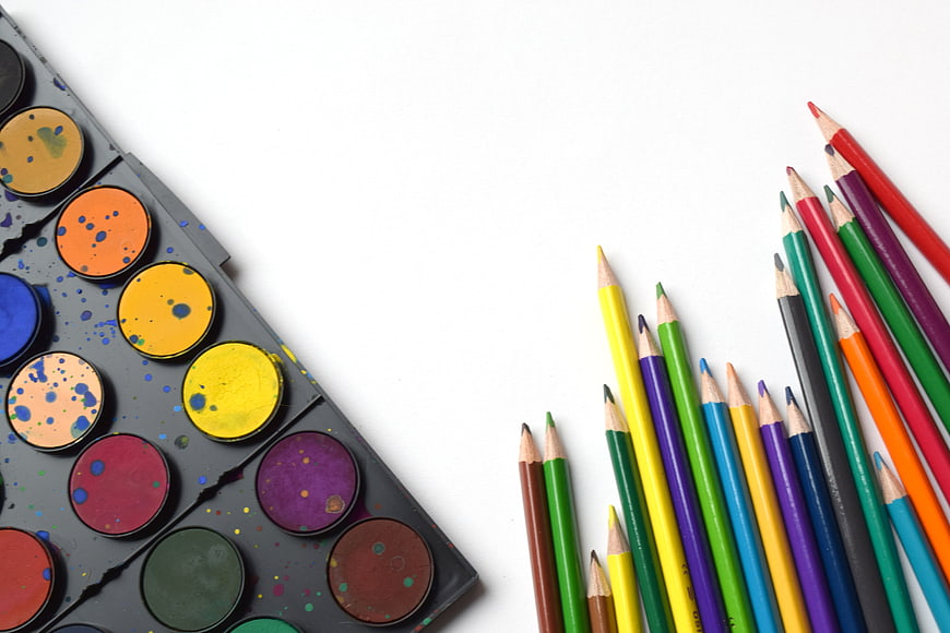 Colorful Art Supplies Flat Lay with Watercolors and Pencils