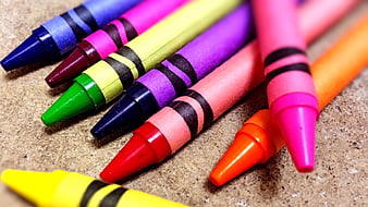 Colorful Crayons Arranged Diagonally On Textured Surface