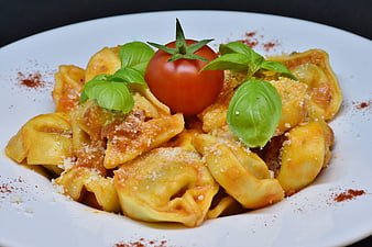 Italian Tortellini Pasta Dish With Fresh Basil And Tomato