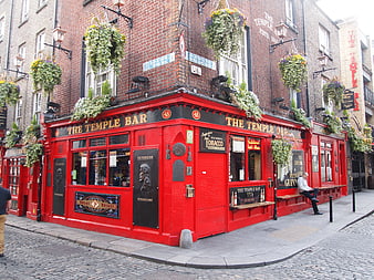 The Temple Bar Pub Facade On Cobblestone Street In Dublin, Ireland