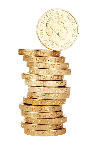 Stack of British Pound Coins with One Balanced on Top