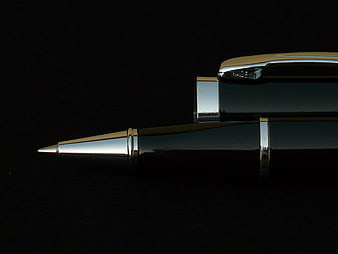 Luxury Black Ballpoint Pen With Gold Accents On Black Background