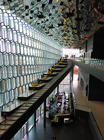 Modern honeycomb glass facade interior with tiered seating