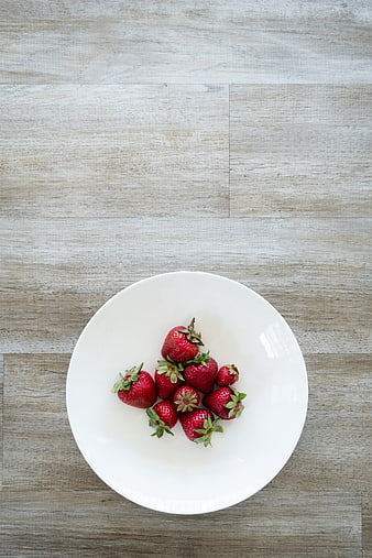 Fresh Strawberries on White Plate Top View
