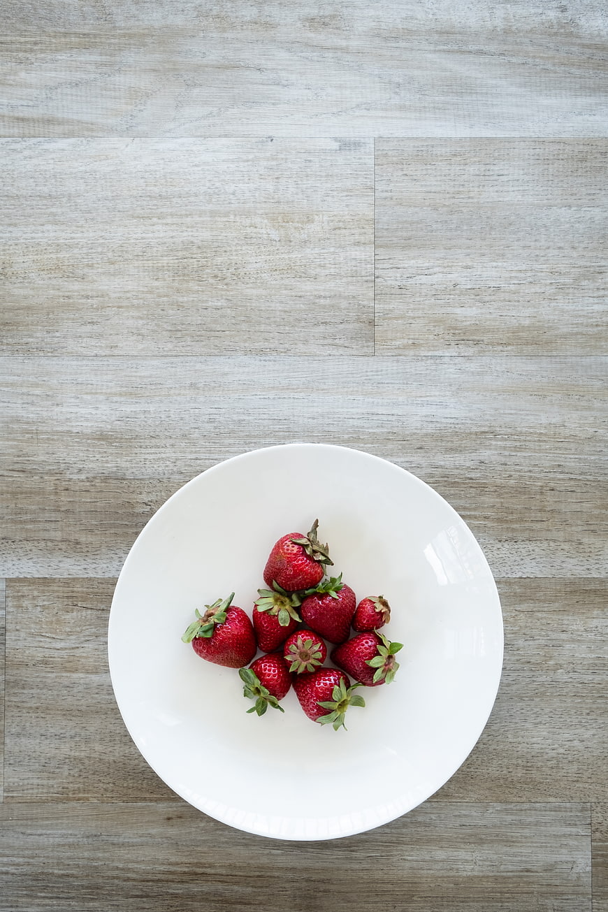 Fresh Strawberries on White Plate Top View