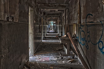Decaying Abandoned Corridor With Graffiti And Debris