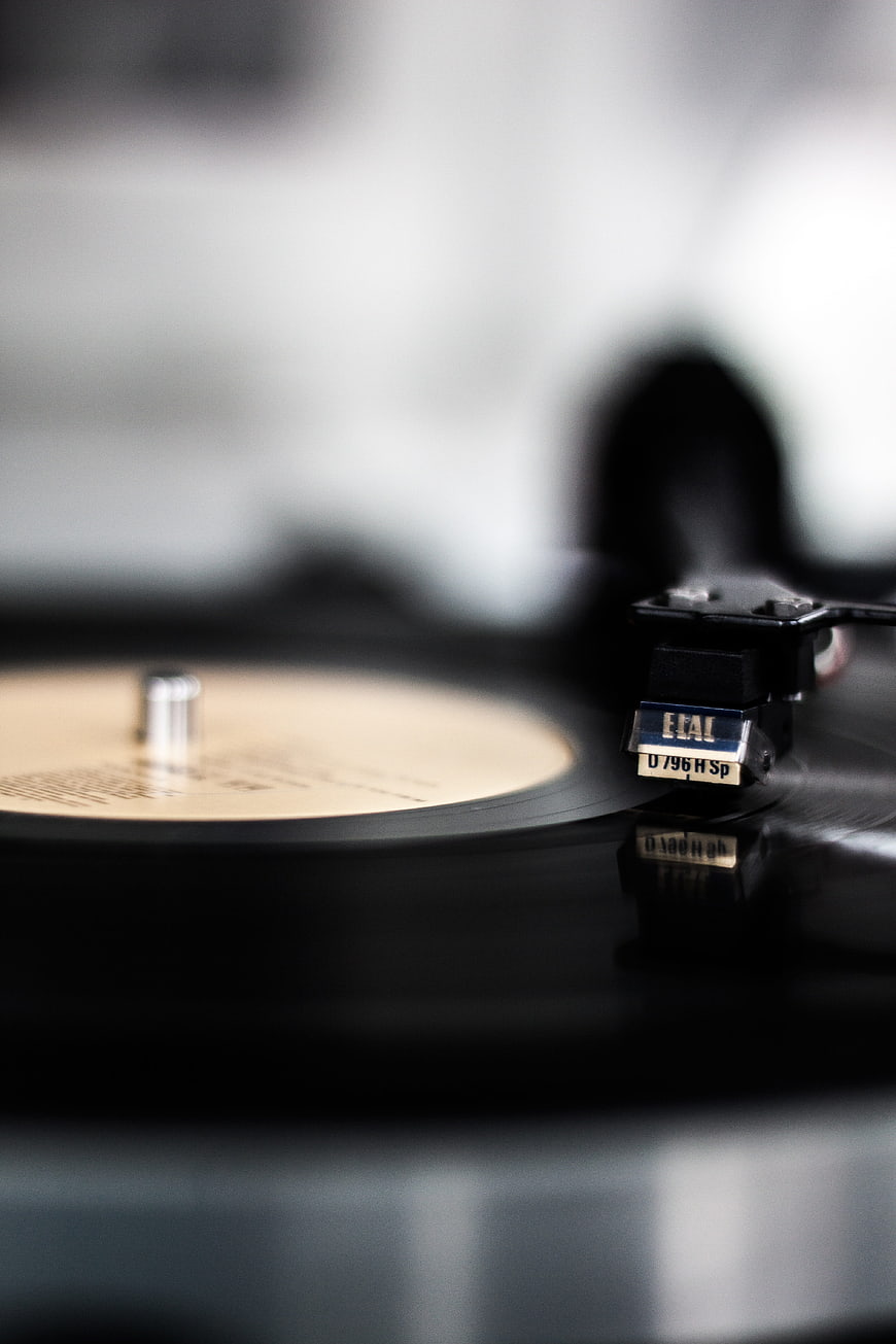 Close-up of a vinyl record player tonearm and needle