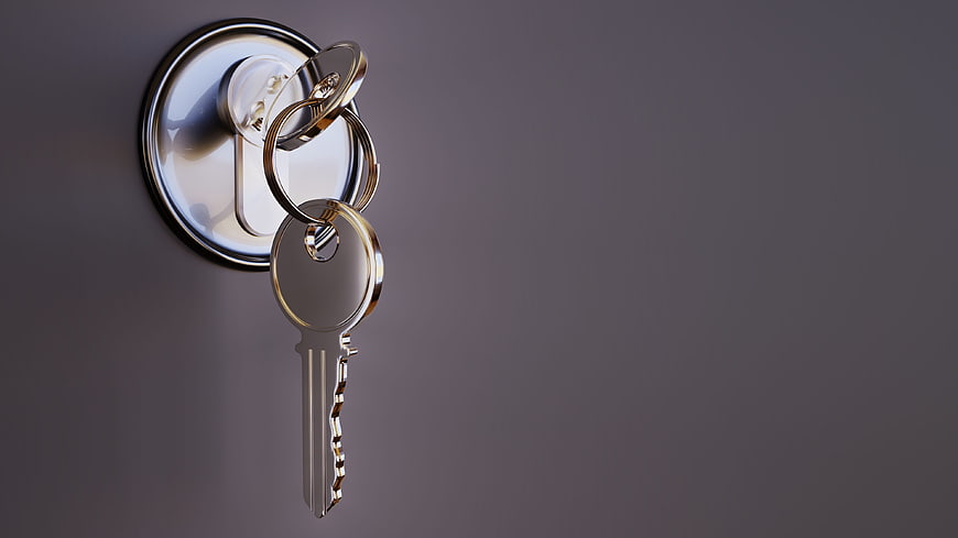 Silver Key in Door Lock with Copyspace