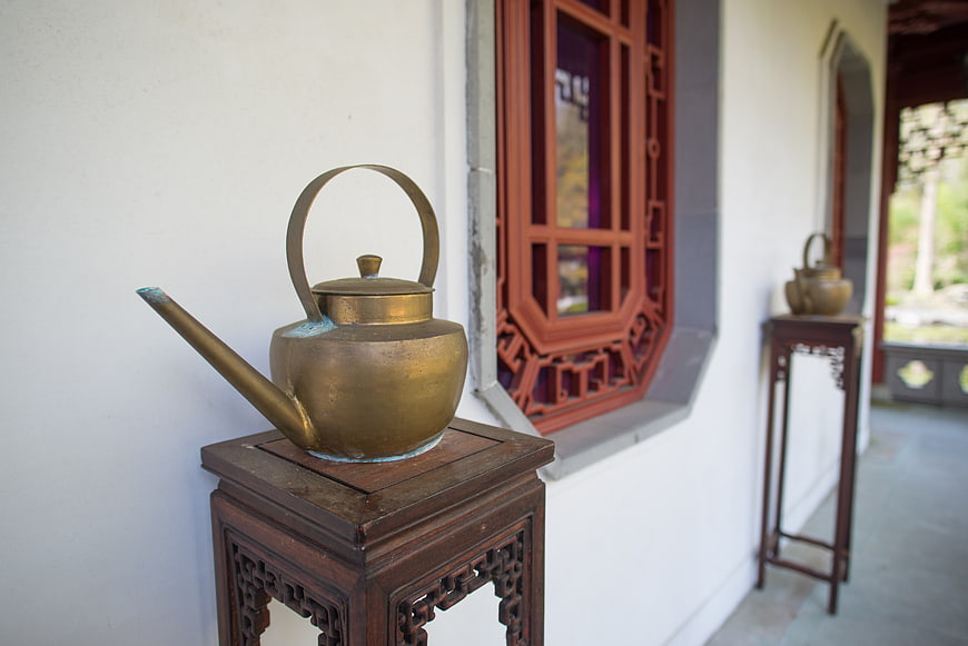 Traditional Chinese Bronze Teapot on Wooden Stand