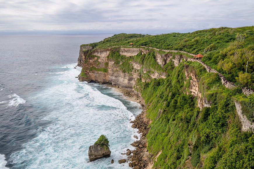 Aerial View of Lush Green Cliffs and Turquoise Ocean in Bali